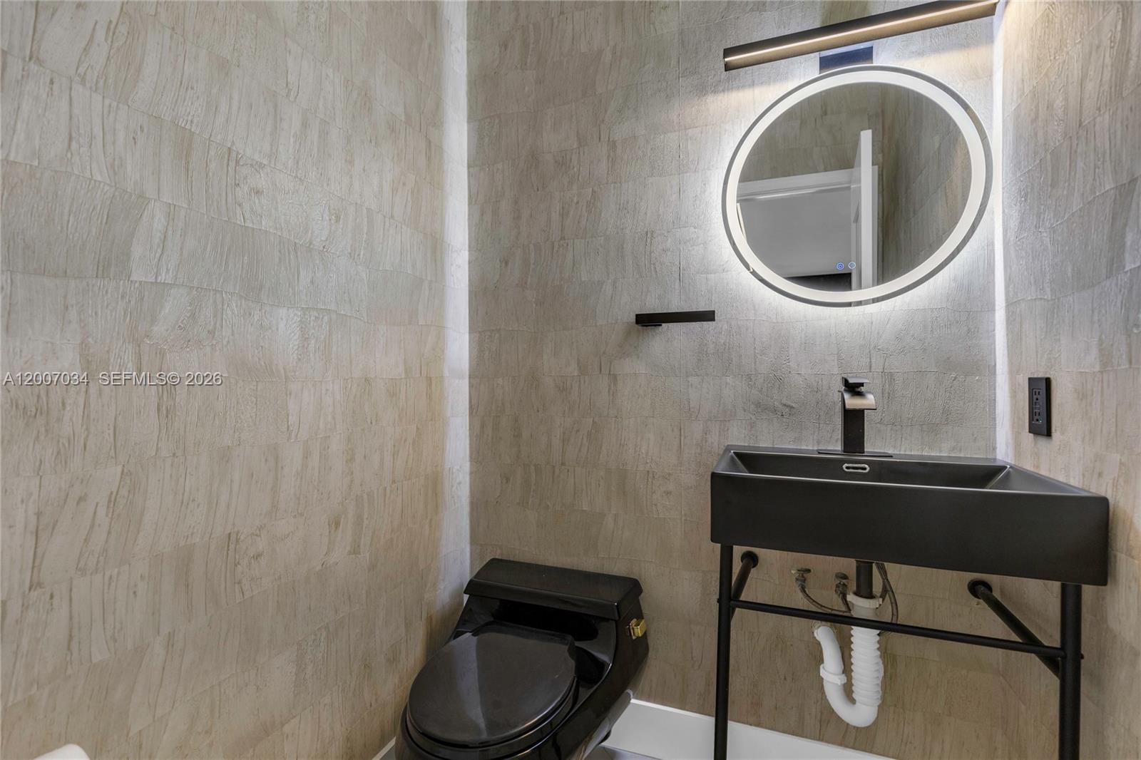 13540 Southwest 98th Court Miami, FL 33176 - Photo 17 of 43 a bathroom with a sink mirror vanity and toilet