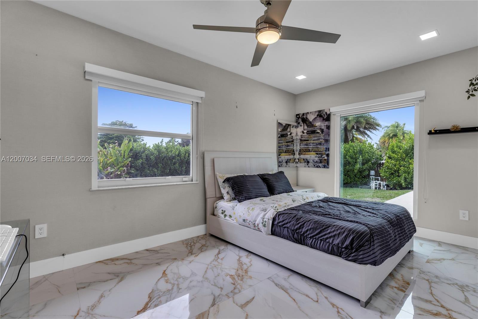 13540 Southwest 98th Court Miami, FL 33176 - Photo 21 of 43 a bedroom with a large bed and a window