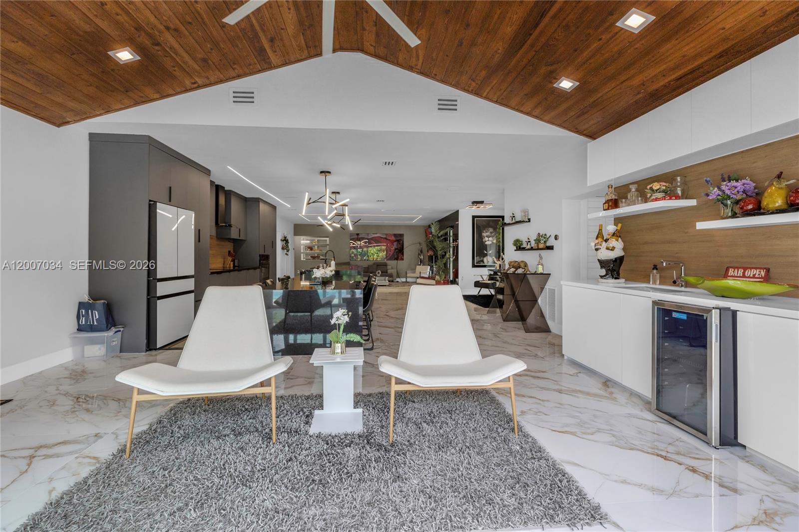 13540 Southwest 98th Court Miami, FL 33176 - Photo 23 of 43 a living room with furniture a rug and kitchen view