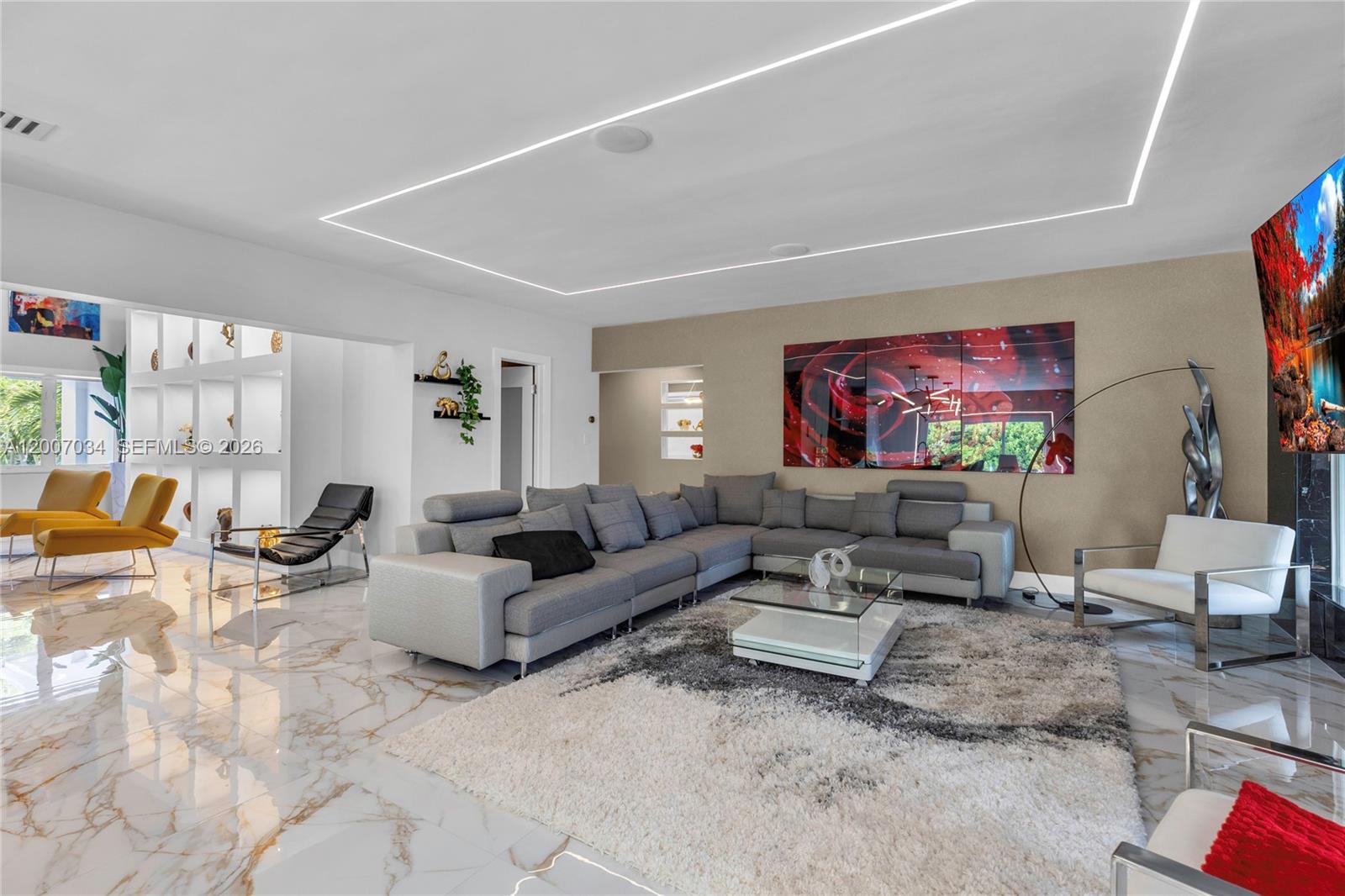 13540 Southwest 98th Court Miami, FL 33176 - Photo 24 of 43 a living room with furniture and a flat screen tv