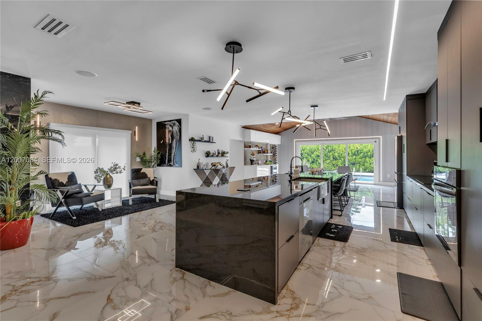 13540 Southwest 98th Court Miami, FL 33176 - Photo 26 of 43 a kitchen with sink cabinets and outdoor living space