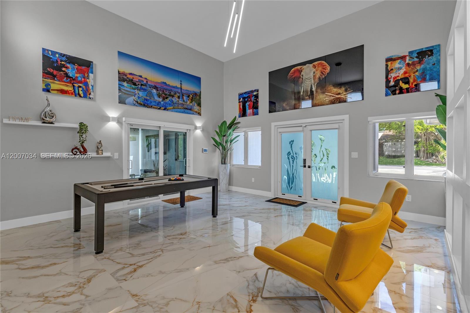 13540 Southwest 98th Court Miami, FL 33176 - Photo 27 of 43 a living room with furniture a rug and a wall painting