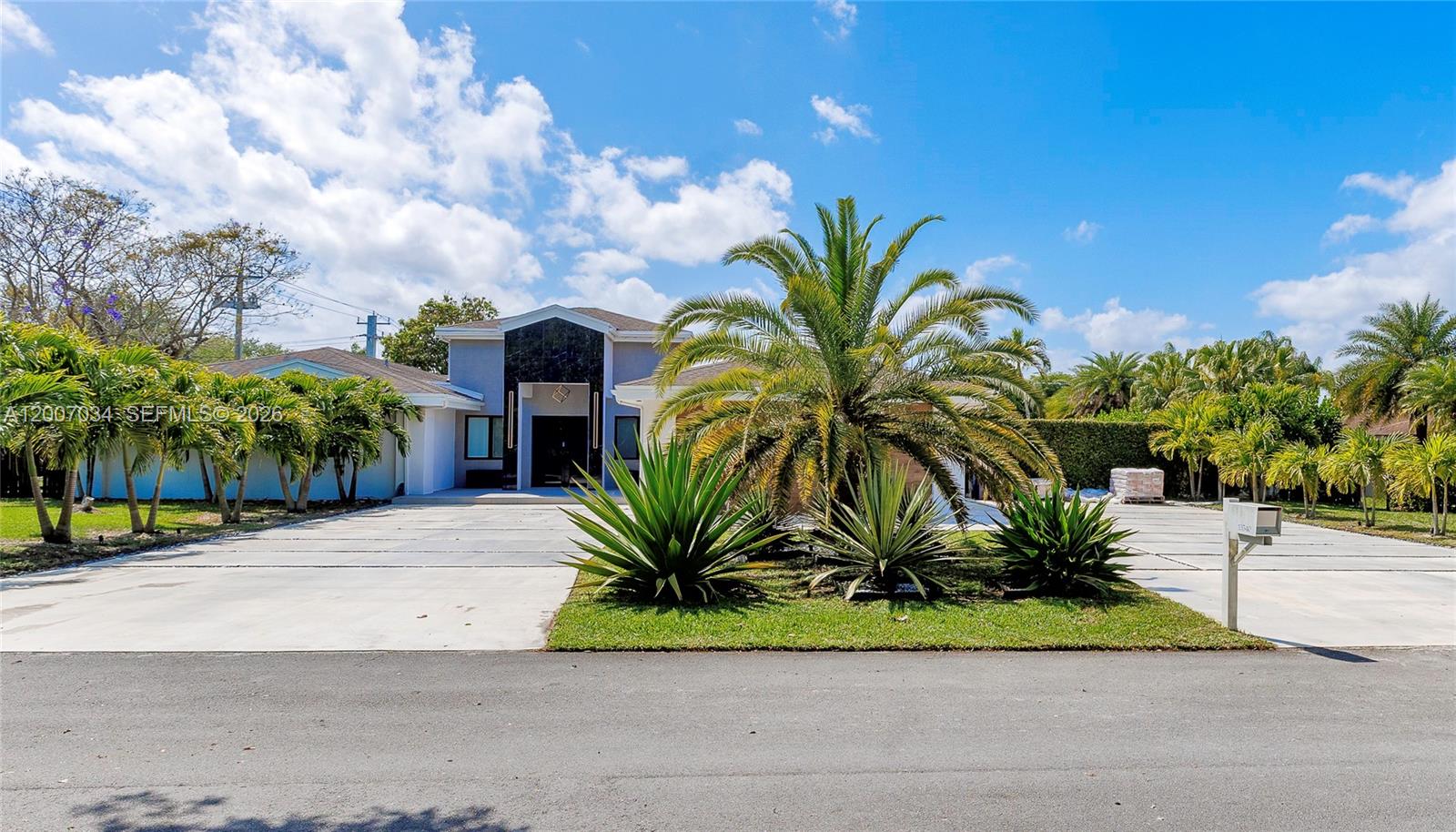 13540 Southwest 98th Court Miami, FL 33176 - Photo 29 of 43 a palm plant sitting in front of a building