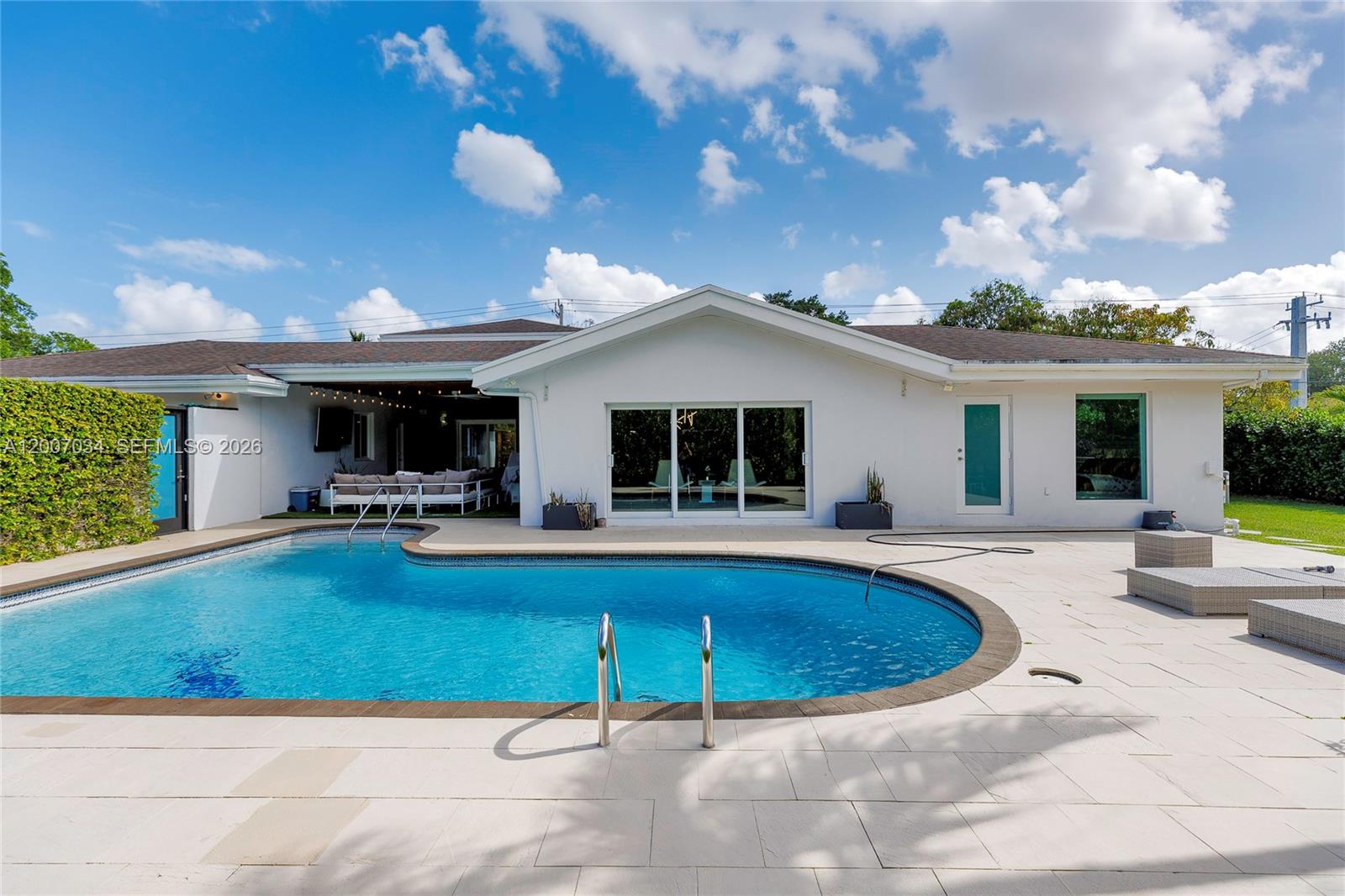 13540 Southwest 98th Court Miami, FL 33176 - Photo 34 of 43 a view of a house with swimming pool and sitting area
