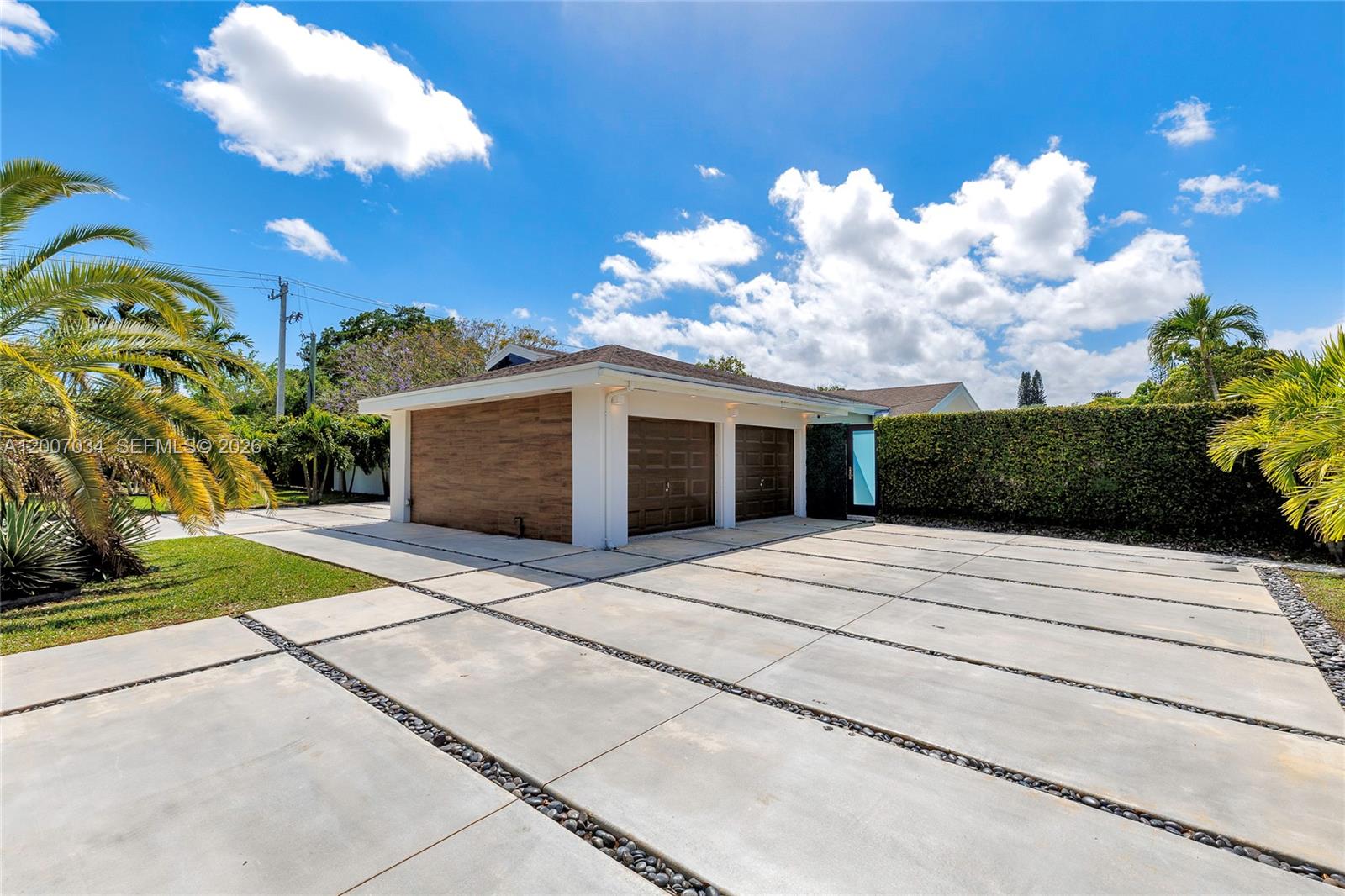 13540 Southwest 98th Court Miami, FL 33176 - Photo 36 of 43 a front view of a house with a yard and garage