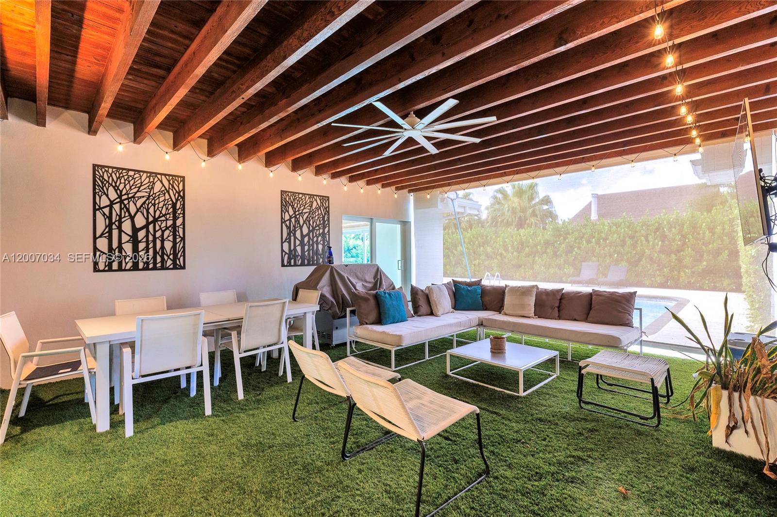 13540 Southwest 98th Court Miami, FL 33176 - Photo 39 of 43 a outdoor room with chairs and a table