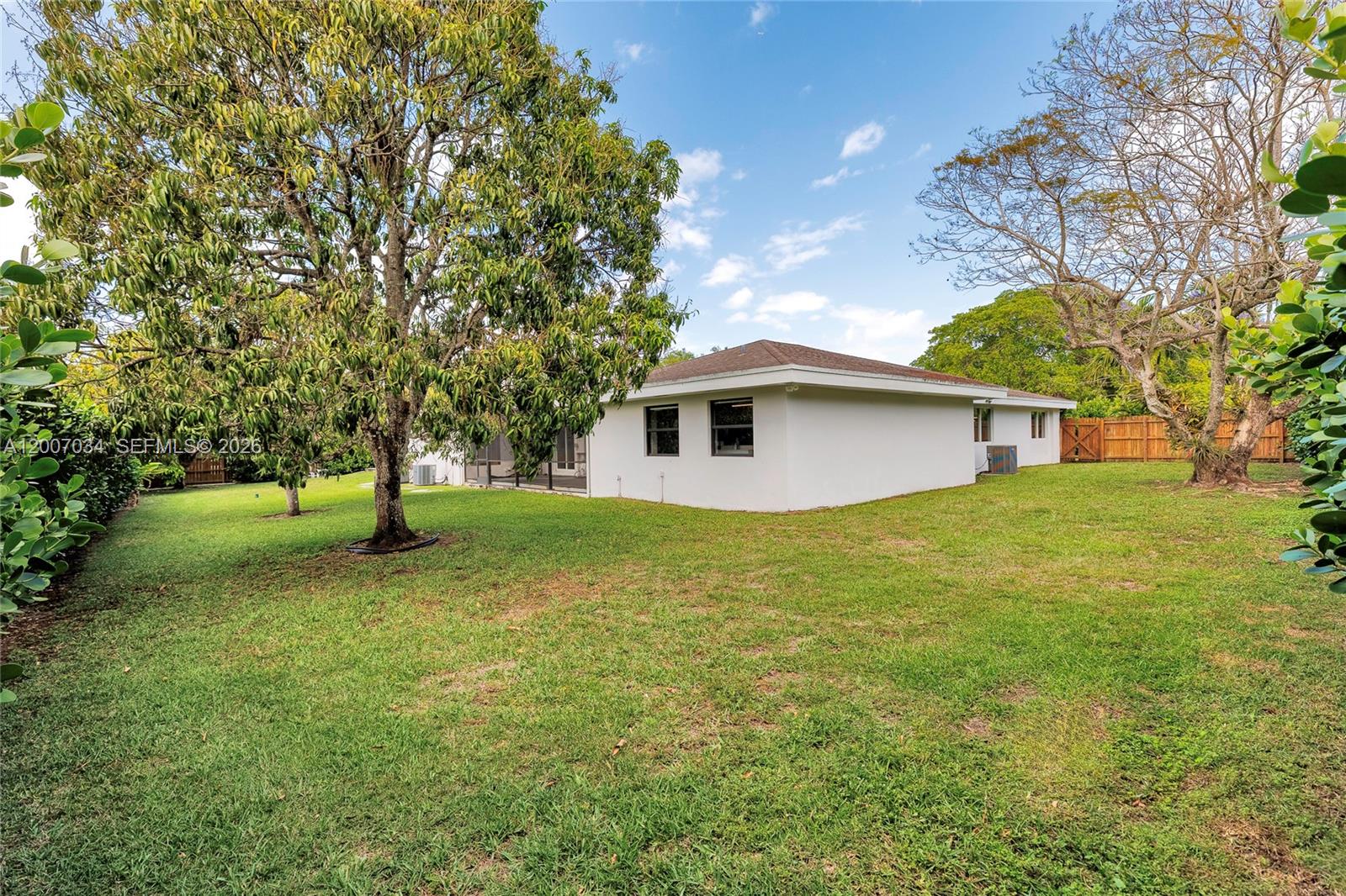 13540 Southwest 98th Court Miami, FL 33176 - Photo 40 of 43 a view of a house with a backyard