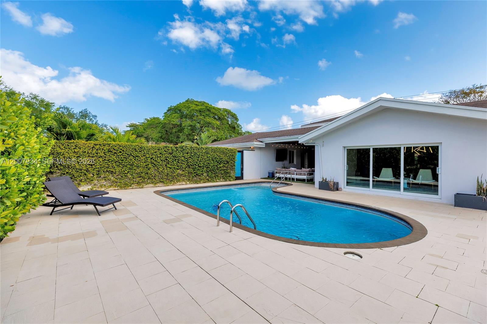 13540 Southwest 98th Court Miami, FL 33176 - Photo 41 of 43 a view of outdoor space yard swimming pool and patio