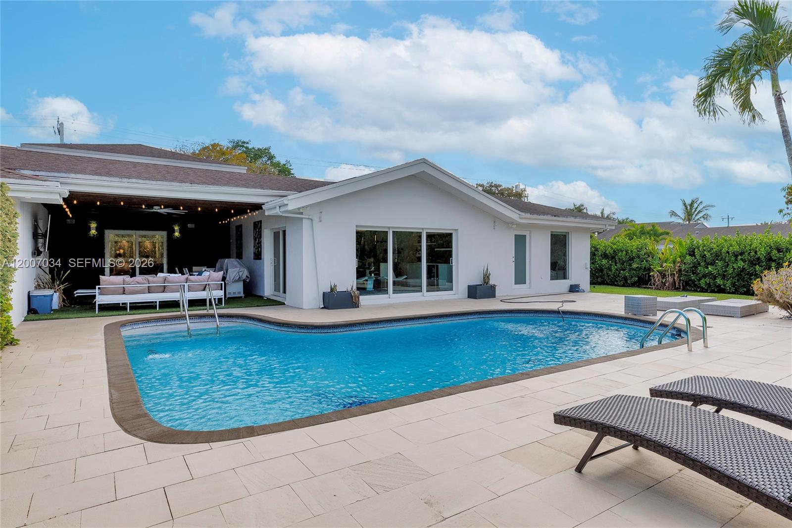 13540 Southwest 98th Court Miami, FL 33176 - Photo 42 of 43 a view of a house with swimming pool and sitting area