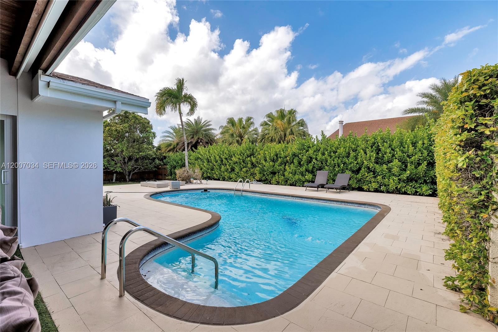 13540 Southwest 98th Court Miami, FL 33176 - Photo 43 of 43 a view of swimming pool with seating space