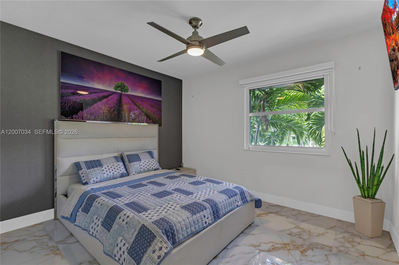 13540 Southwest 98th Court Miami, FL 33176 - Photo 6 of 43 a bedroom with a large bed and a potted plant