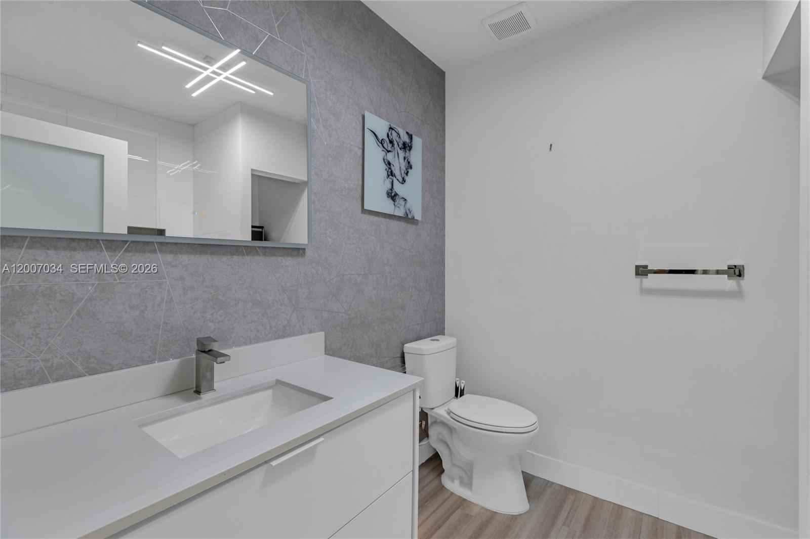 13540 Southwest 98th Court Miami, FL 33176 - Photo 8 of 43 a bathroom with a toilet a sink and mirror