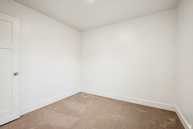 1627 North Angel Street Layton, UT 84041 - Photo 7 of 39 Spare room featuring carpet floors and baseboards