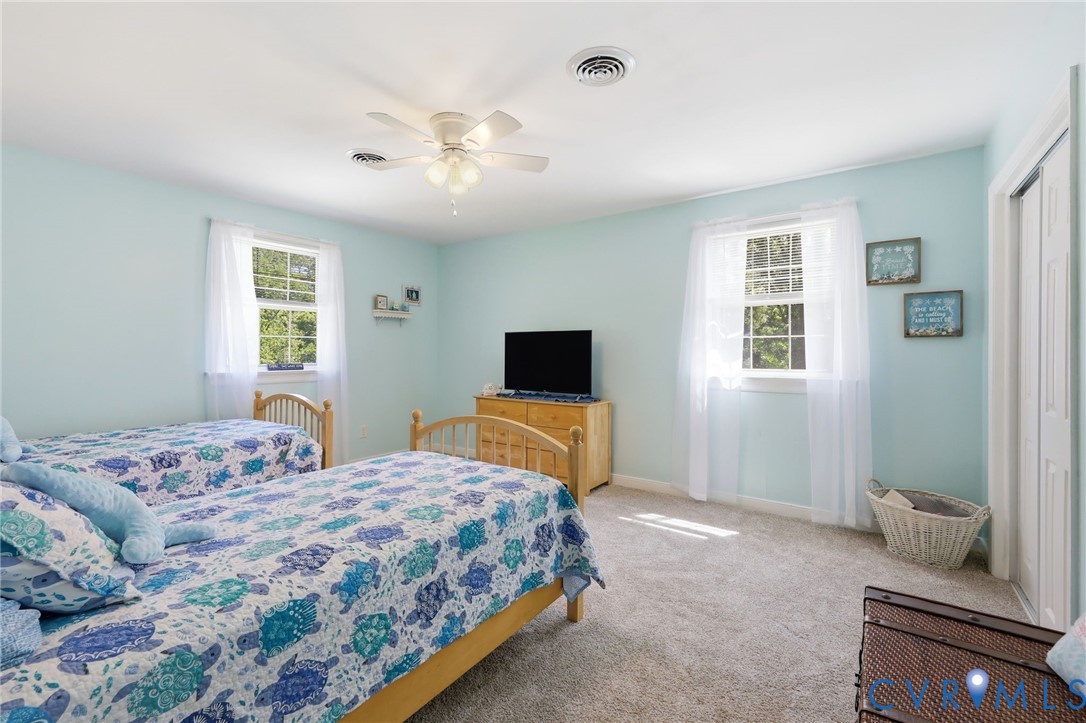 11200 Surry Road Chester, VA 23831 - Photo 32 of 48 a bedroom with a bed and a television