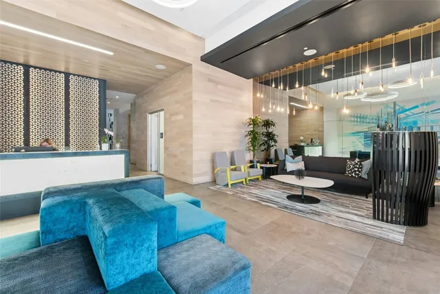 a living room with furniture and a rug