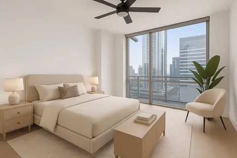 a bedroom with a bed and a large window