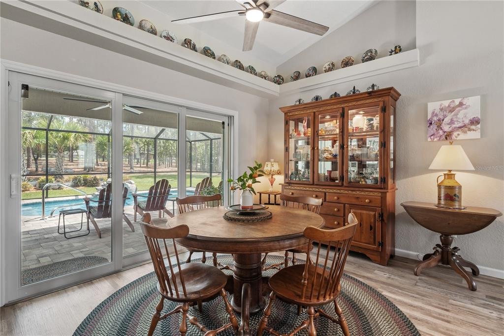 12929 Southwest 89th Street Dunnellon, FL 34432 - Photo 12 of 76 a view of a dining room with furniture window and outside view