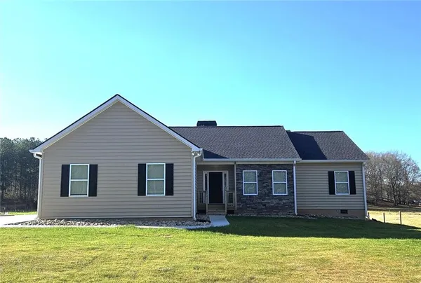a front view of a house with a yard
