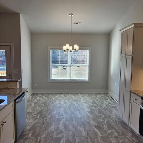 a view of a kitchen with a sink and a window