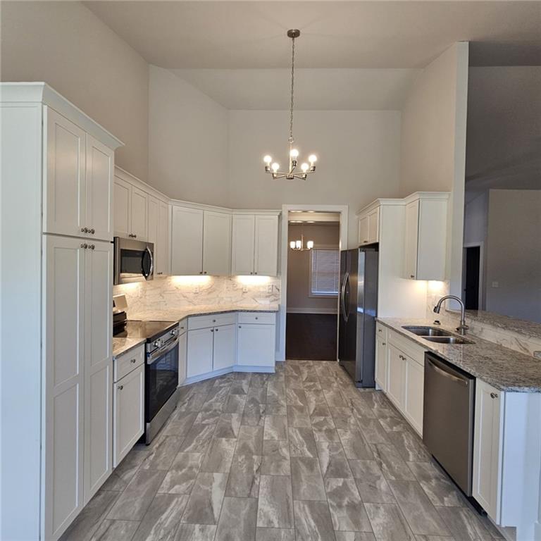 201 Damascus Road Homer, GA 30547 - Photo 6 of 37 a large kitchen with stainless steel appliances granite countertop a sink refrigerator and cabinets