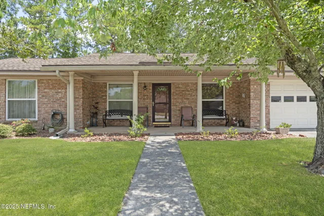 front view of a house with a yard