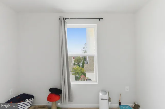 a view of an entryway and wooden floor