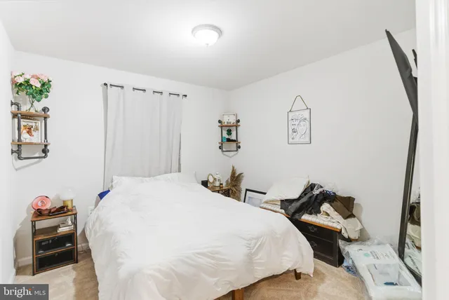 a bathroom with a sink a toilet and shower curtain