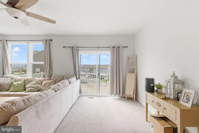 a spacious bedroom with a large bed and a large window