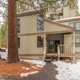 a view of a house with snow on the road