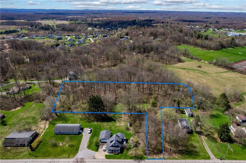 573 East Main St Extension Grove City, PA 16127 - Photo 2 of 7 a view of a lake with a mountain and trees