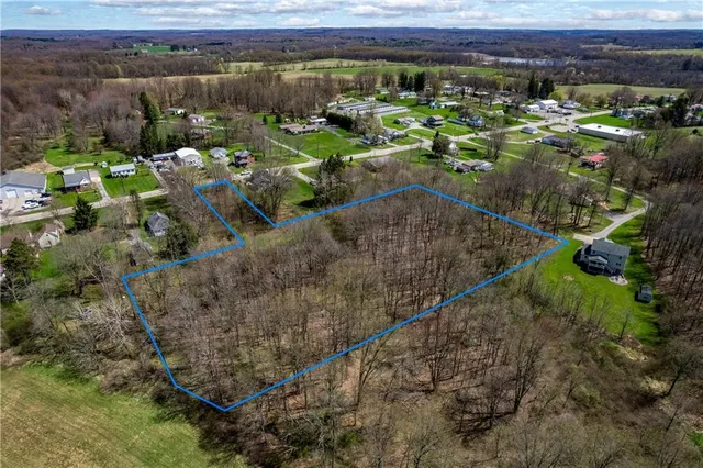 a view of a street with a yard