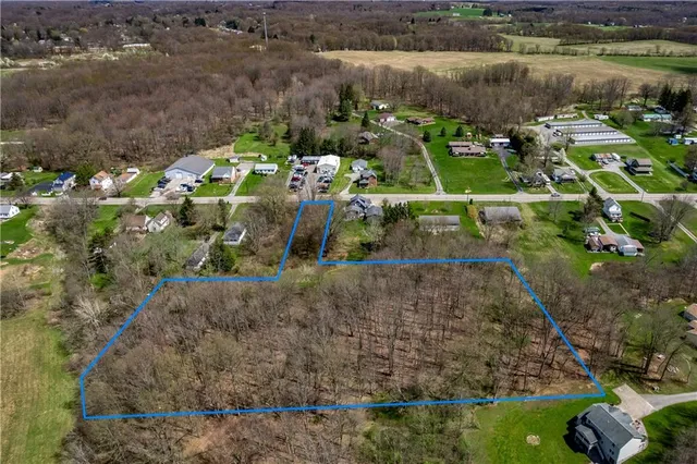 a view of a lake with large trees
