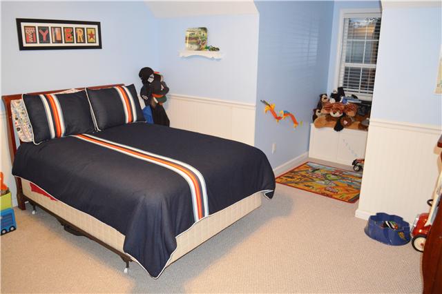 116 Ruben Road Spring Hill, TN 37174 - Photo 14 of 20 Another Upstairs Bedroom has Lots of Room to Sleep & Play! Love the Beadboard on the Walls & the Window Nook for Extra Space (custom toy boxes do not remain)!
