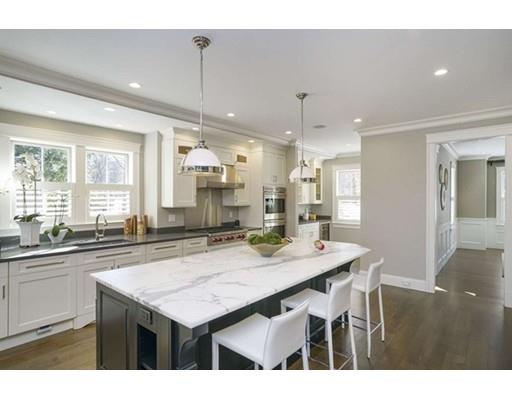 20 Gammons Road Newton, MA 02468 - Photo 11 of 28 a kitchen with a counter top space sink stove and cabinets