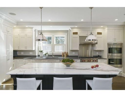 20 Gammons Road Newton, MA 02468 - Photo 12 of 28 a kitchen with kitchen island stainless steel appliances a sink and cabinets