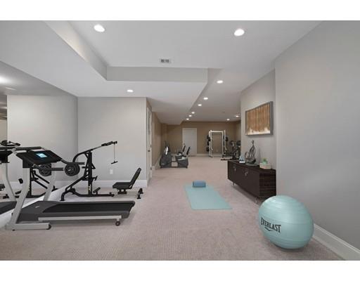 20 Gammons Road Newton, MA 02468 - Photo 27 of 28 a living room with furniture a mirror and gym equipment