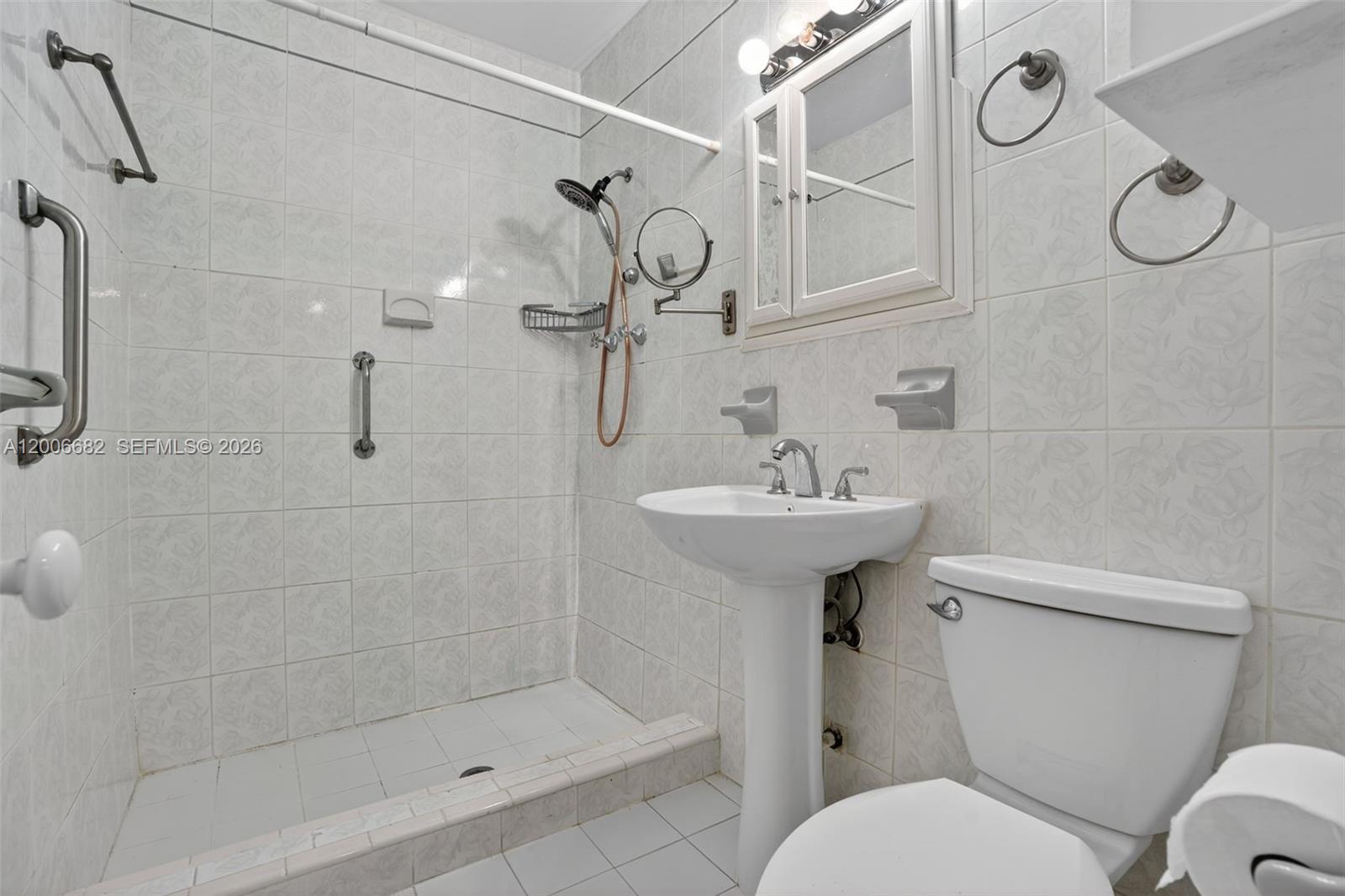 1435 Blue Road Coral Gables, FL 33146 - Photo 17 of 31 a bathroom with a sink toilet and shower