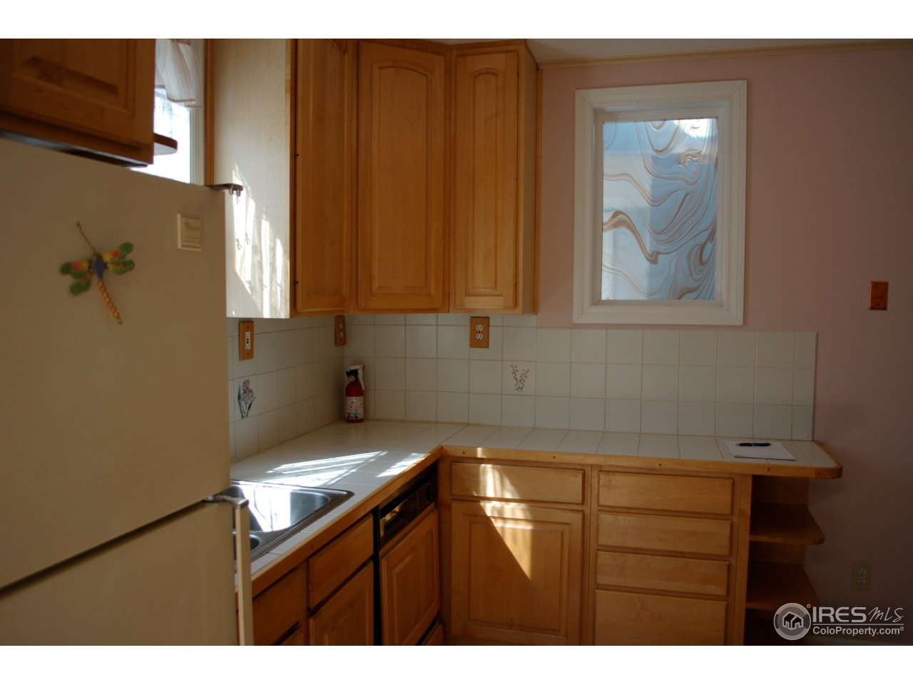 2447 20th Street Boulder, CO 80304 - Photo 11 of 12 a kitchen with a sink and cabinets