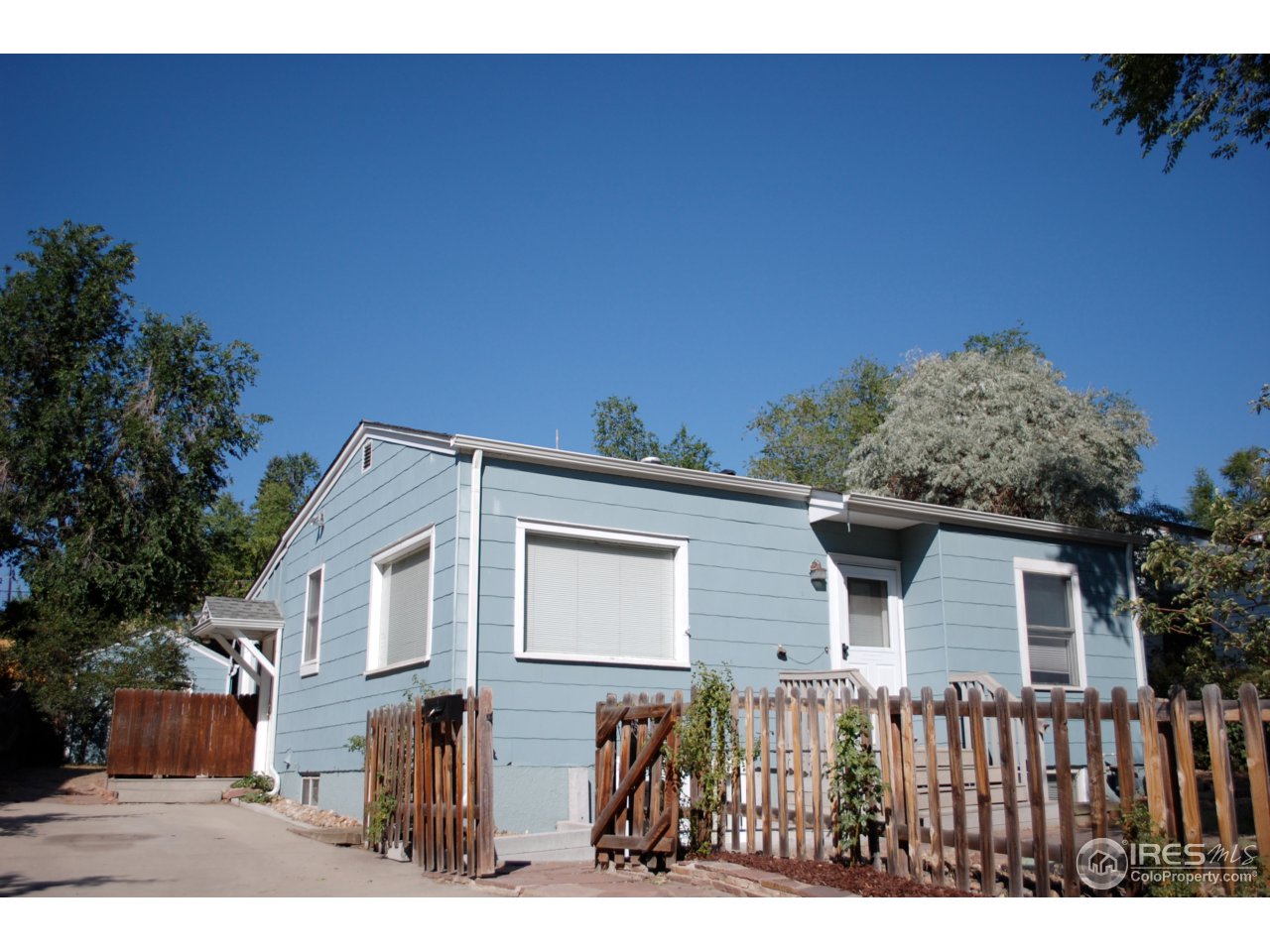 2447 20th Street Boulder, CO 80304 - Photo 12 of 12 a front view of a house with a yard
