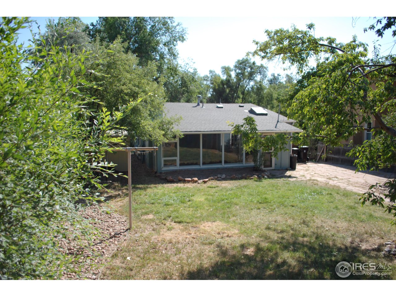 2447 20th Street Boulder, CO 80304 - Photo 6 of 12 a view of a house with a yard and sitting area
