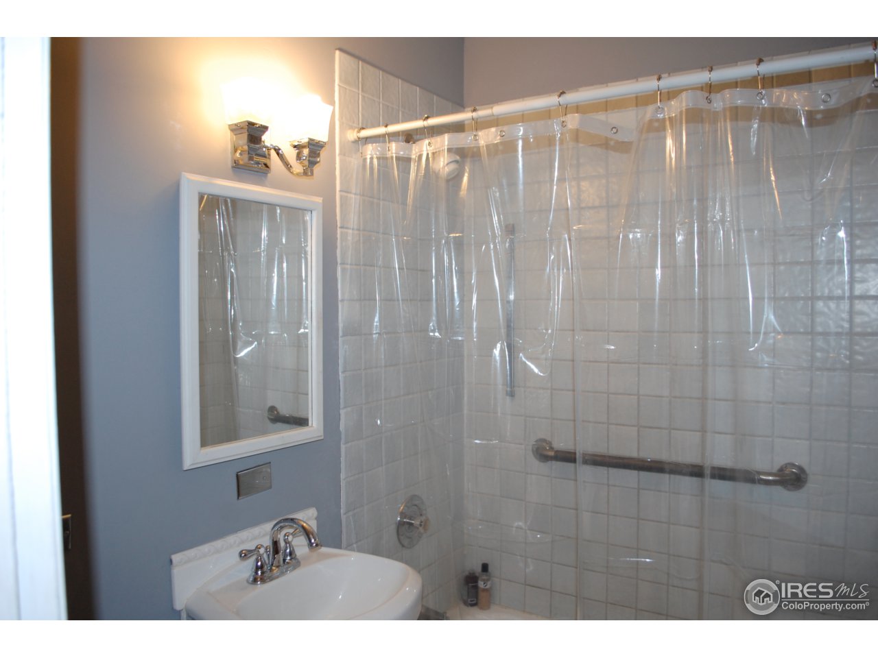 2447 20th Street Boulder, CO 80304 - Photo 10 of 12 a bathroom with a sink and a mirror