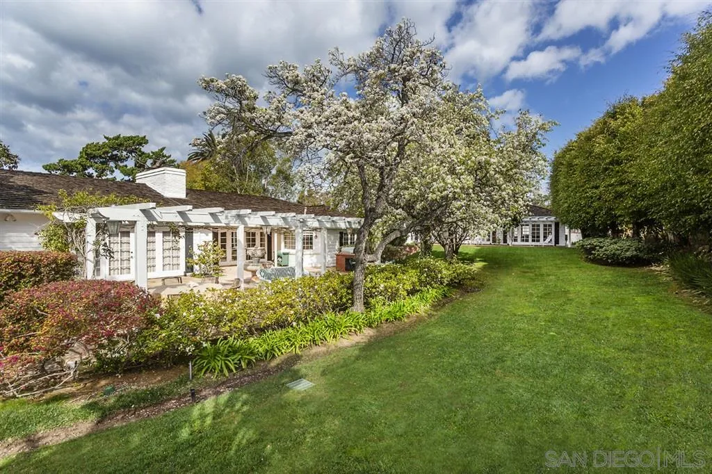 8317 La Jolla Shores Drive La Jolla, CA 92037 - Photo 21 of 25 a view of a house with a garden