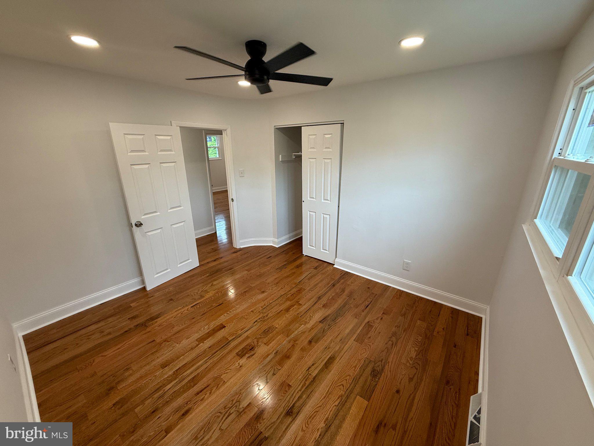1104 Church Road Wyncote, PA 19095 - Photo 15 of 31 wooden floor in an empty room with a window