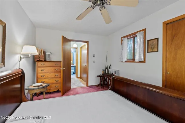 a bed room with a bed and a dresser