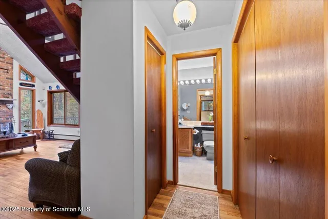 a view of a livingroom with furniture and front door