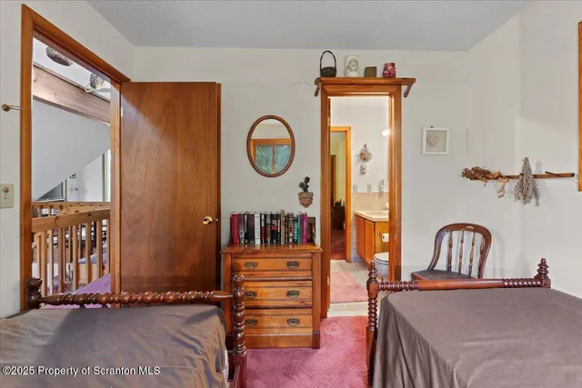 a view of a hallway with entryway wooden floor and front door