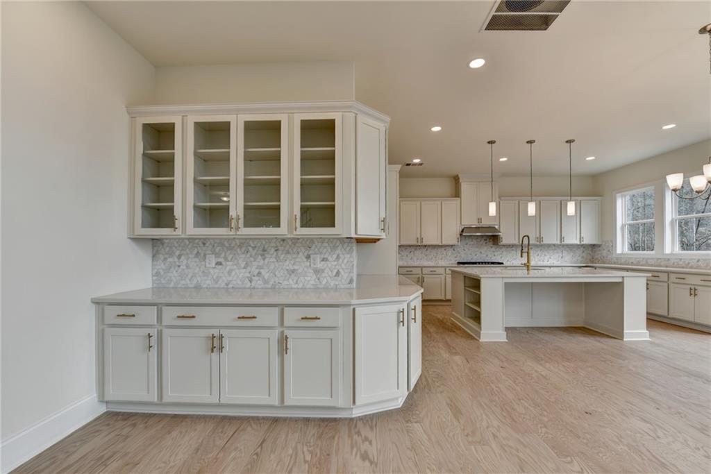 2470 Stewart Road Cumming, GA 30041 - Photo 15 of 61 a kitchen with a sink and cabinets