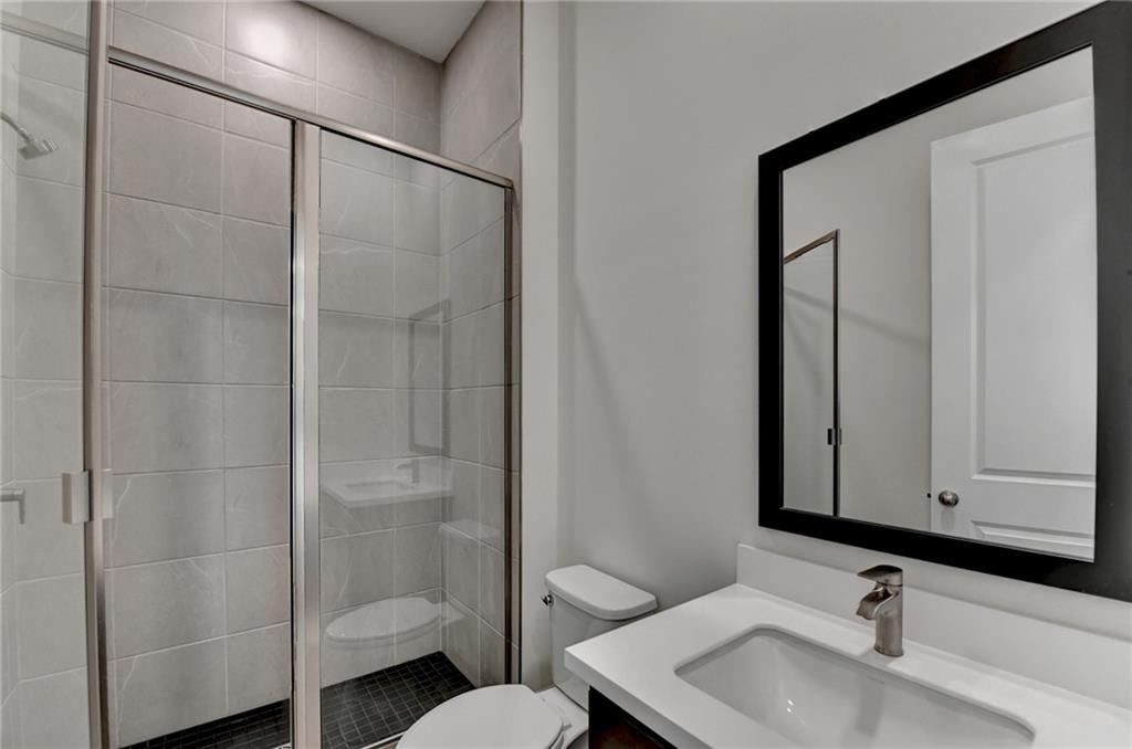 2470 Stewart Road Cumming, GA 30041 - Photo 29 of 61 a bathroom with a sink toilet and shower