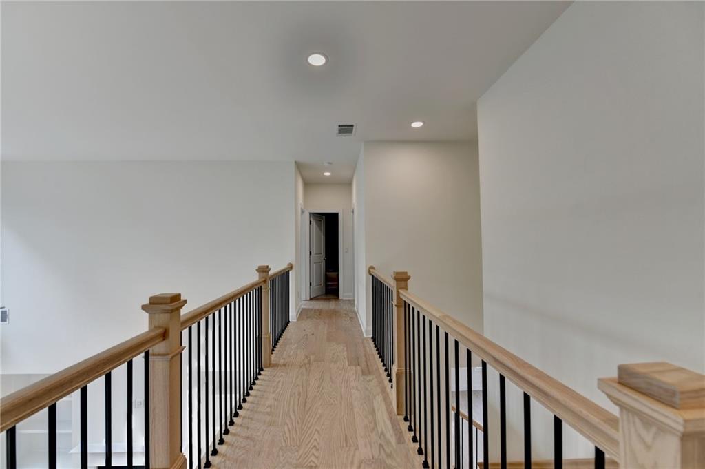 2470 Stewart Road Cumming, GA 30041 - Photo 31 of 61 a view of a hallway with wooden floor