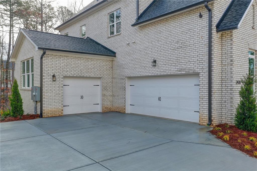 2470 Stewart Road Cumming, GA 30041 - Photo 4 of 61 a view of a house with a garage